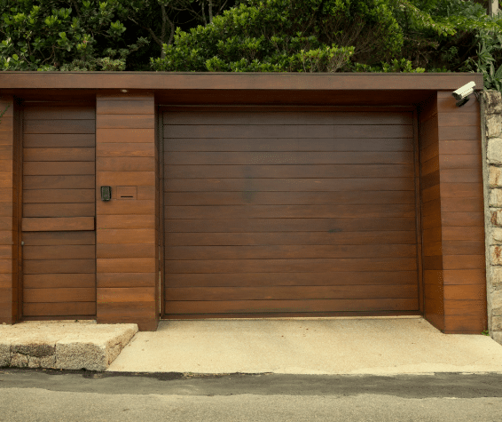 Wooden garage door with pedestrian door.