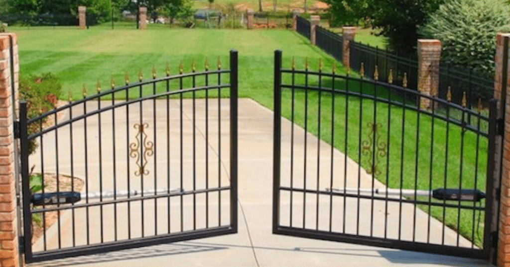 Black automatic wrought iron driveway gates.