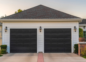Black Garage Doors on White House